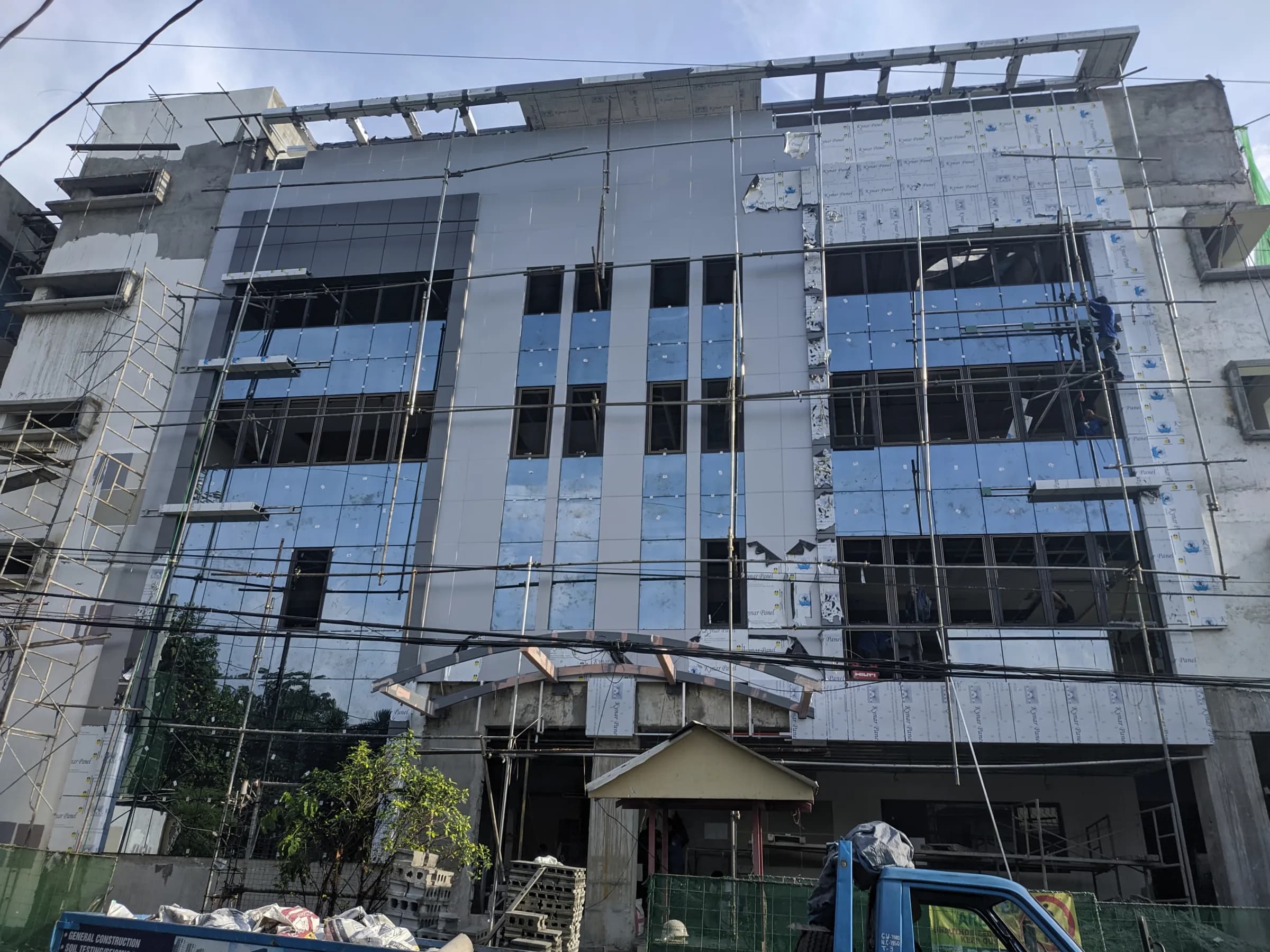 Jubilee Center facade with scaffolding and exterior panels being installed