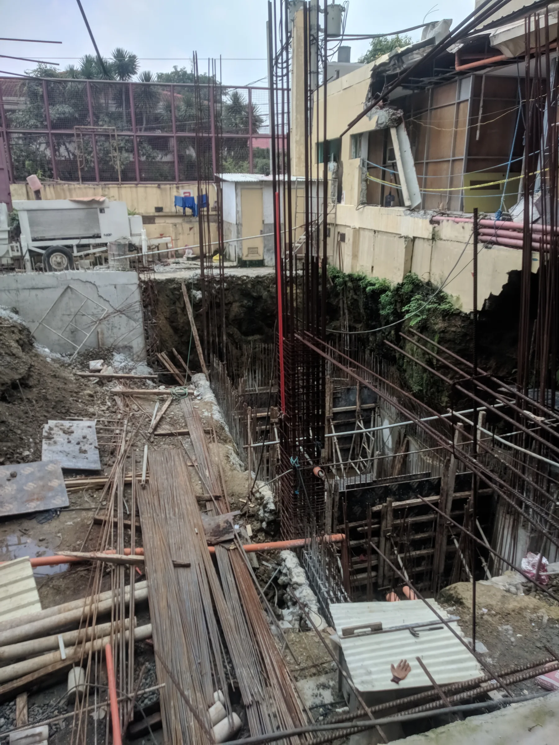 Jubilee Center construction site with exposed foundations, rebar, and formwork