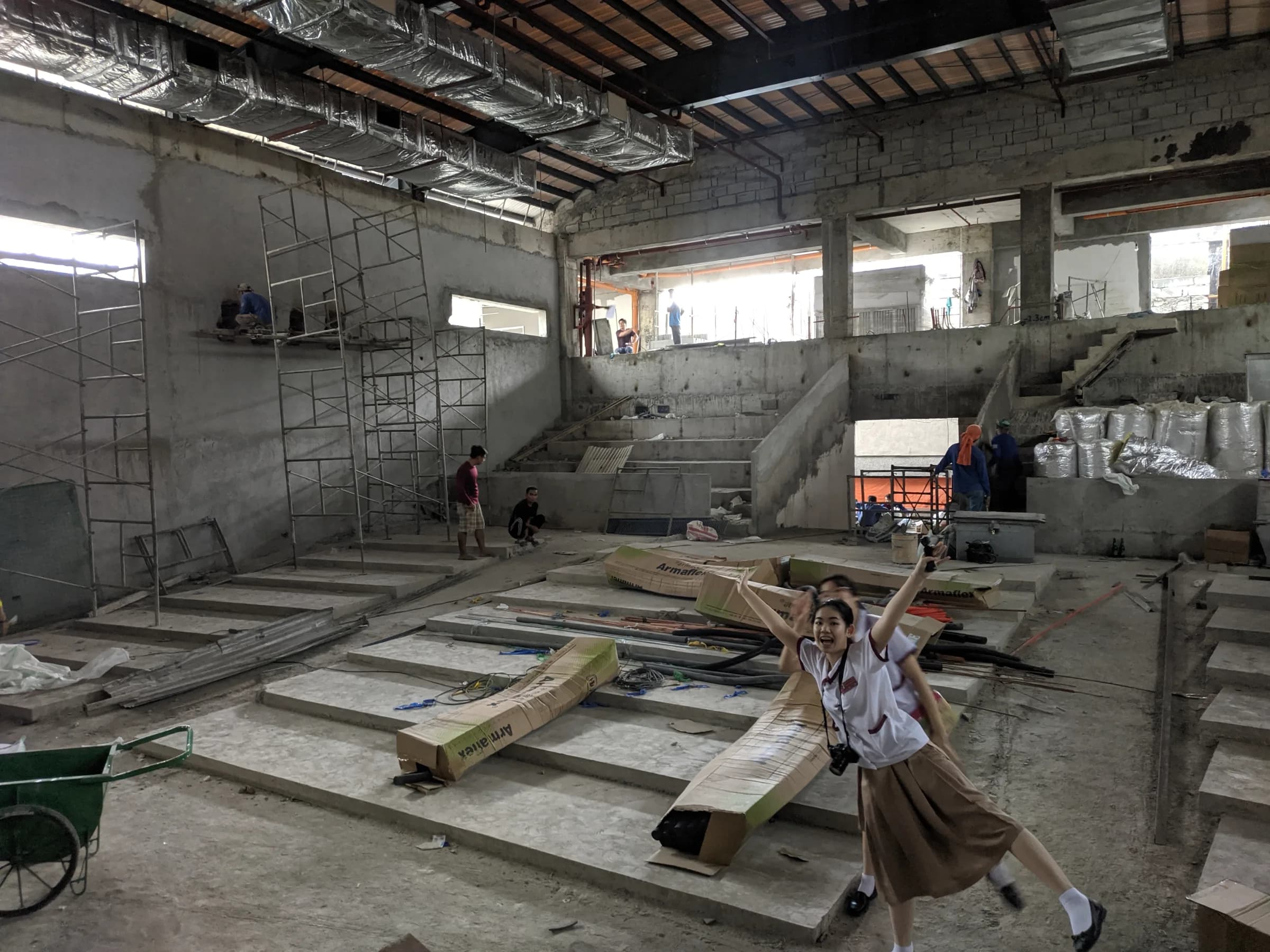Riana Bautista and Ellise Lim inside the unfinished Jubilee Center auditorium