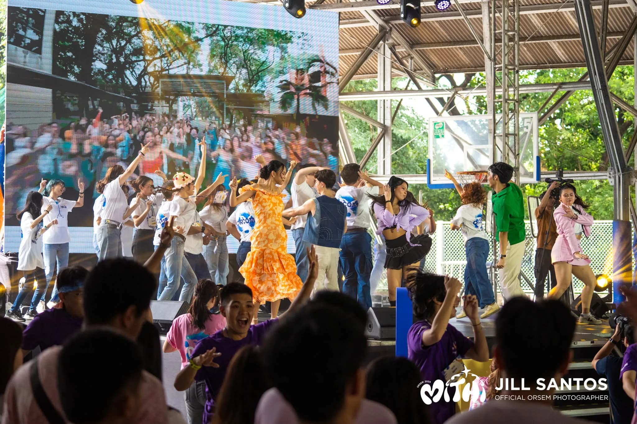 OrSem performers and volunteers dancing together onstage